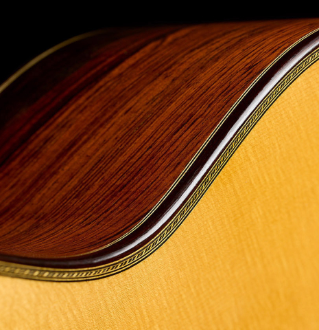 The top binding and purfling of a 2001 Paulino Bernabe "Imperial" classical guitar made of spruce and CSA rosewood