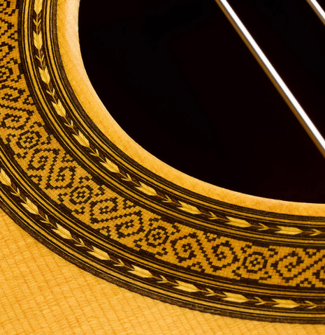 The soundboard and rosette of a 2001 Paulino Bernabe "Imperial" classical guitar made of spruce and CSA rosewood