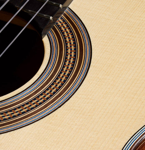 The soundboard and rosette of a 2026 Tobias Berg "Bouchet" classical guitar made of spruce and Indian rosewood