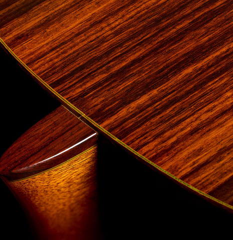 The heel, back binding and purfling of a 1972 Paulino Bernabe classical guitar made of cedar and Indian rosewood