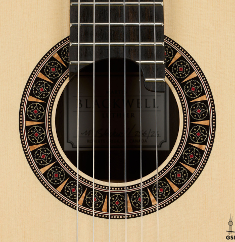 The rosette of a 2026 Martin Blackwell "640" double-top classical guitar made of spruce and Indian rosewood