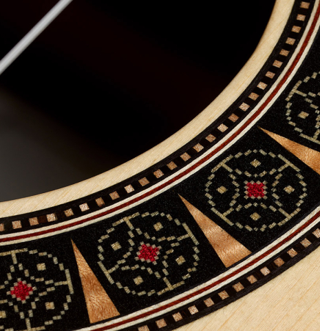 Detailed close-up of the rosette of a 2026 Martin Blackwell "640" double-top classical guitar made of spruce and Indian rosewood