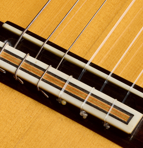The bridge, tie-block and saddle of a 1997 Tom Blackshear "1976 Rodriguez" classical guitar made of spruce and CSA rosewood