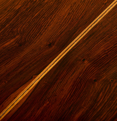 The back center seam of a 1997 Tom Blackshear "1976 Rodriguez" classical guitar made of spruce and CSA rosewood