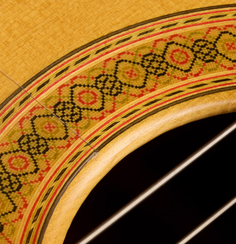 Detailed close-up of the rosette of a 1997 Tom Blackshear "1976 Rodriguez" classical guitar made of spruce and CSA rosewood