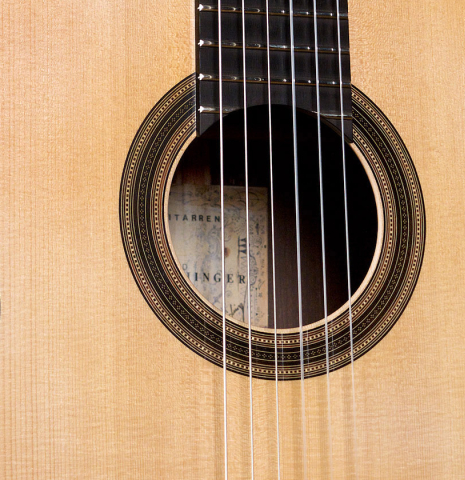 This is the spruce soundboard and rosette of a 2021 Edmund Blöchinger SP/CSAR classical guitar