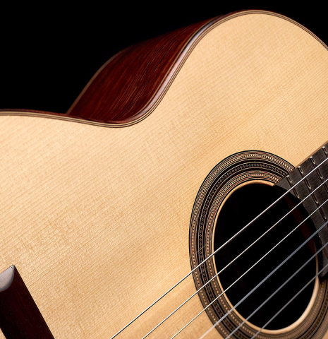 This is the spruce soundboard and rosette of a 2022 Edmund Blöchinger SP/CSAR classical guitar