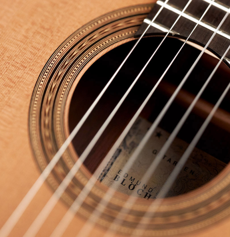 The soundboard and rosette of a 2023 Edmund Blöchinger "Llobet" classical guitar made with cedar top and CSA rosewood back and sides.