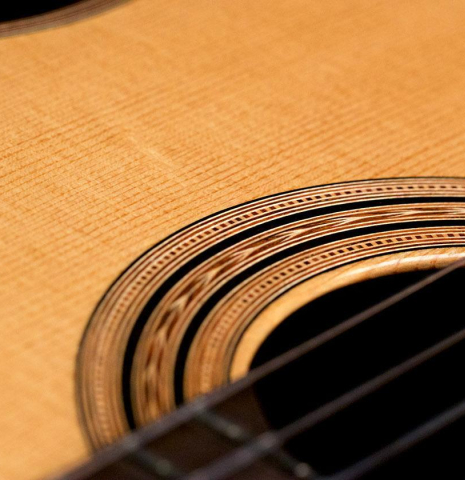 The rosette of a 1997 Edmund Blöchinger classical guitar made with spruce top and Indian rosewood back and sides.