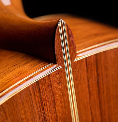 The heel of a 1997 Edmund Blöchinger classical guitar made with spruce top and Indian rosewood back and sides.