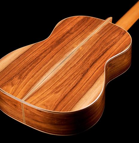 This is a CSA rosewood back of a 2000 Edmund Blochinger classical guitar on a black background