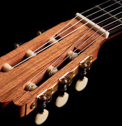 The headstock and tuners of a 2004 Edmund Blöchinger classical guitar made with spruce and CSA rosewood
