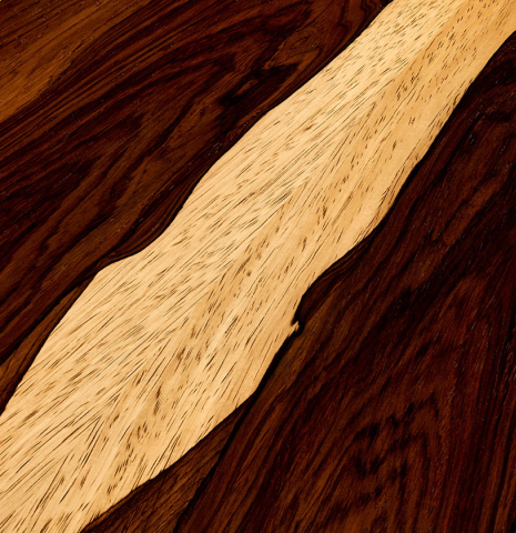 The back center seam of a 2003 Edmund Blöchinger classical guitar made of cedar and CSA rosewood