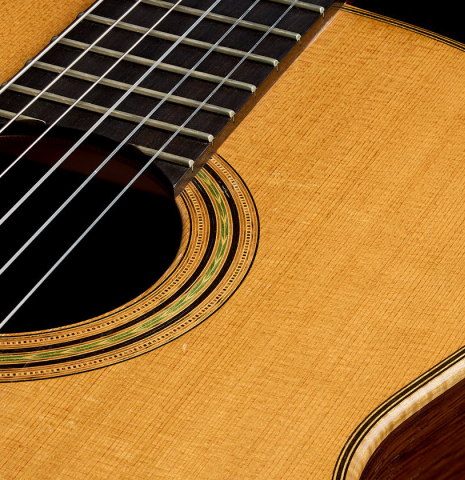 The soundboard and rosette of a 2003 Edmund Blöchinger classical guitar made of cedar and CSA rosewood