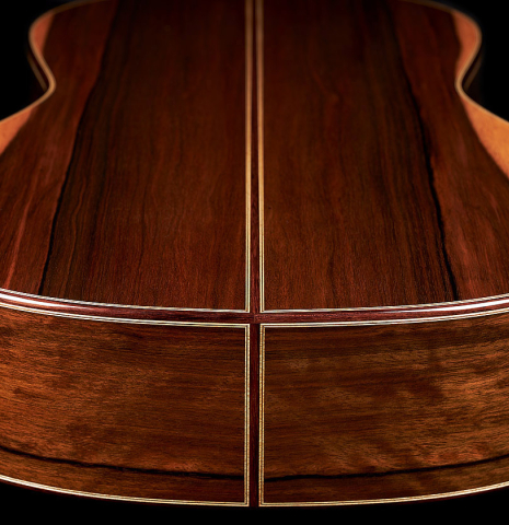 The back and sides at the foot of a 2023 Elias Bonet classical guitar made of cedar and green ebony