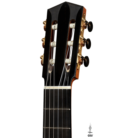 The headstock of a 2023 Elias Bonet classical guitar made of cedar and green ebony