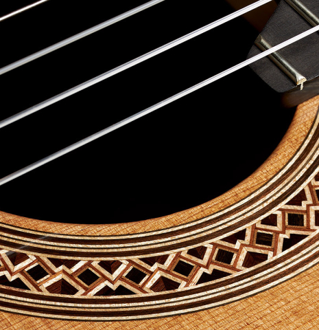 Closeup of the rosette of a 2023 Elias Bonet classical guitar made of cedar and green ebony