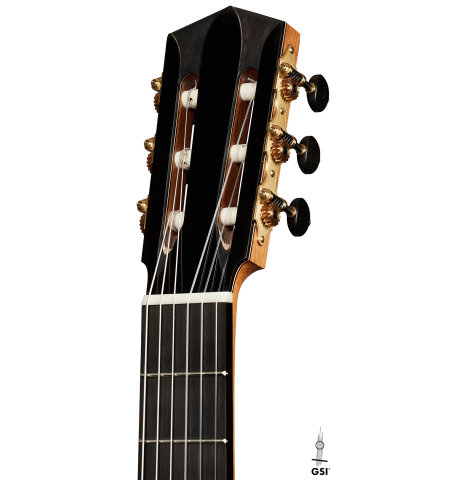 The headstock of a 2025 Elias Bonet classical guitar made of cedar and green ebony