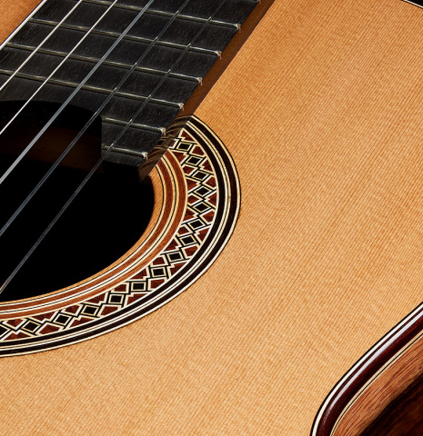 The soundboard and rosette detail of a 2025 Elias Bonet classical guitar made of cedar and green ebony