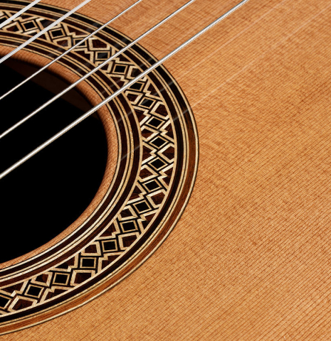 The soundboard and rosette detail of a 2024 Elias Bonet classical guitar made of cedar and African rosewood