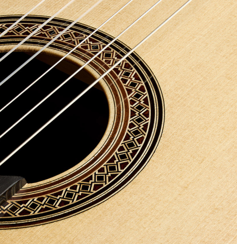 The soundboard and rosette detail of a 2025 Elias Bonet classical guitar made of spruce and green ebony
