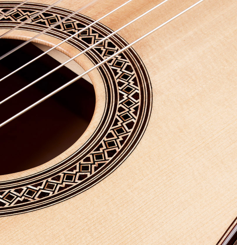Closeup detail of the rosette of a 2024 Elias Bonet classical guitar made of spruce and maple