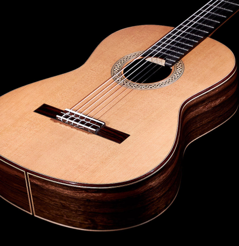 The soundboard of a 2023 Elias Bonet "Aire" classical guitar made of cedar and Green ebony.