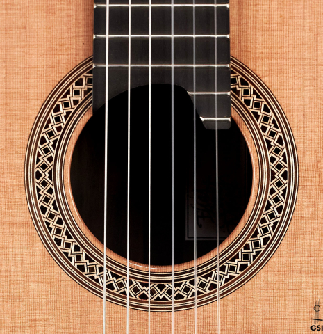 The rosette of a 2023 Elias Bonet "Aire" classical guitar made of cedar and Green ebony.