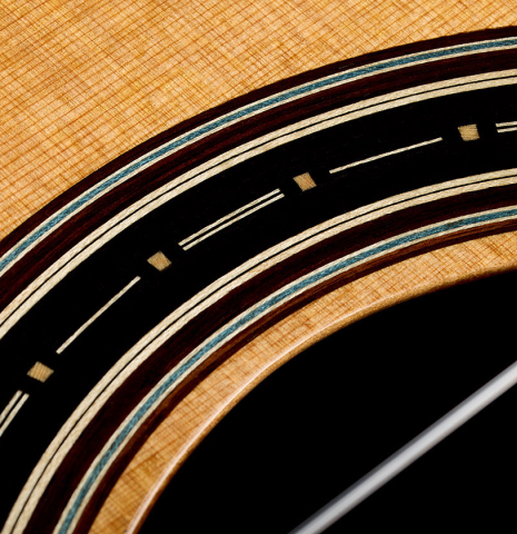 Close up detail of the rosette of a 2026 Marco Bortolozzo "Furore" classical guitar made of cedar and Indian rosewood