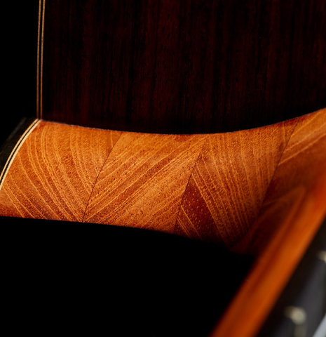 The heel and fingerboard of a 2024 Eduardo Bossa classical guitar made of spruce and Indian rosewood