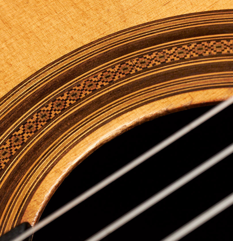 The rosette of a 1957 Robert Bouchet classical guitar made with spruce and CSA rosewood.