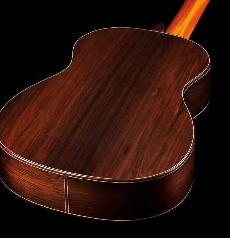 The back and sides at the foot of a 2019 Greg Brandt classical guitar made of cedar and CSA rosewood
