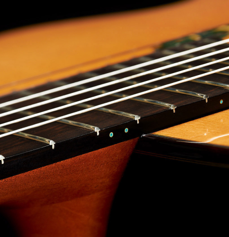 The fingerboard and heel of a 2019 Greg Brandt classical guitar made of cedar and CSA rosewood