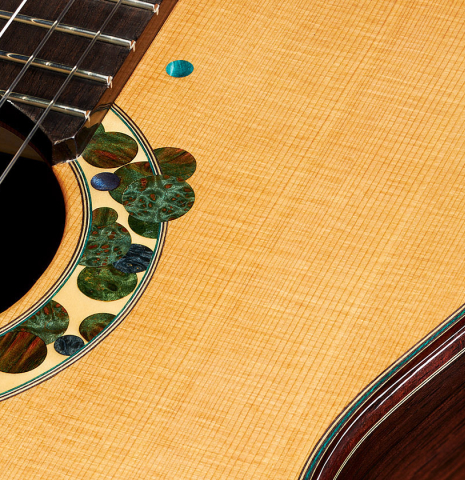 The top, side and rosette of a 2019 Greg Brandt classical guitar made of cedar and CSA rosewood