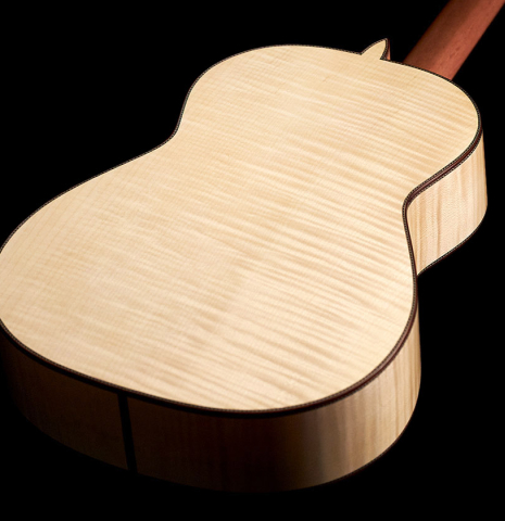 The back of a 2023 Kenneth Brogger classical guitar made of spruce and maple.