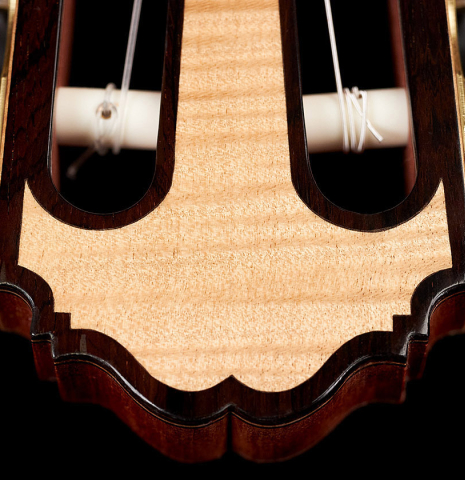 The headstock of a 2023 Kenneth Brogger classical guitar made of spruce and maple.