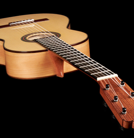 This is a view from the headstock of a 2023 Kenneth Brogger "1890 Torres" w/pegs classical guitar made of spruce and cypress