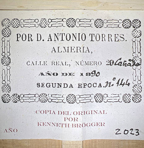 This is the label of a 2023 Kenneth Brogger "1890 Torres" w/pegs classical guitar made of spruce and cypress