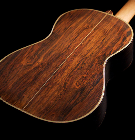 The back and sides of a 2021 Kenneth Brogger "1864 Torres" classical guitar made of spruce and CSA rosewood