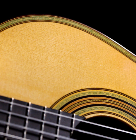 The soundboard of a 2021 Kenneth Brogger "1864 Torres" classical guitar made of spruce and CSA rosewood
