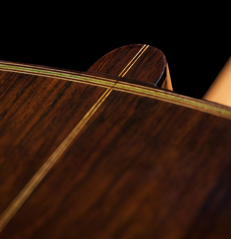 The back, heel and center seam of a 2021 Kenneth Brogger "1864 Torres" classical guitar made of spruce and CSA rosewood
