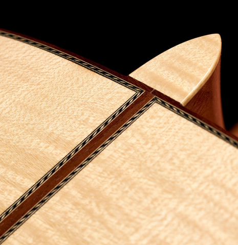 The back and heel of a 2008 Kenneth Brogger classical guitar made of spruce and maple