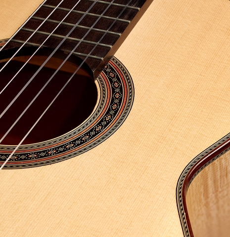The soundboard of a 2008 Kenneth Brogger classical guitar made of spruce and maple