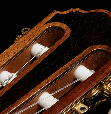 The headstock veneer with ebony inlay of a 2025 Kenneth Brogger "Mosaic" classical guitar made of spruce and Indian rosewood