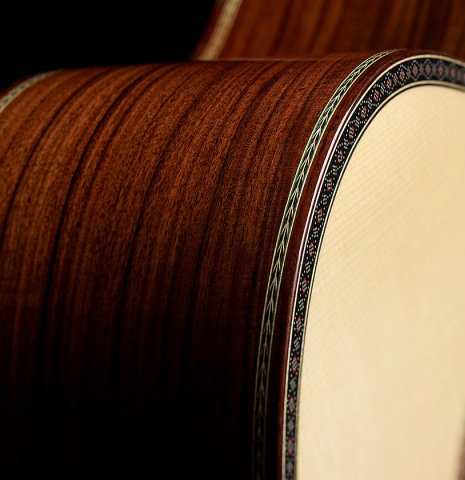 The top binding and purflings of a 2025 Kenneth Brogger "Mosaic" classical guitar made of spruce and Indian rosewood