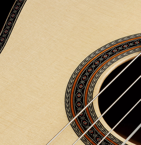 The soundboard and rosette of a 2025 Kenneth Brogger "Mosaic" classical guitar made of spruce and Indian rosewood
