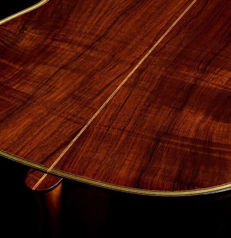 The heel, back binding and purfling of a 2009 Kenneth Brogger "1864 Torres" classical guitar made of spruce and CSA rosewood