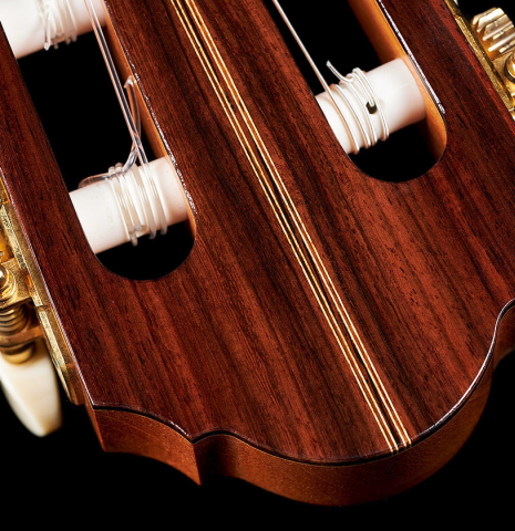 The headstock veneer and tuning machines of a 2023 Ivan Bruna "Limited Edition" classical guitar made of spruce and Indian rosewood