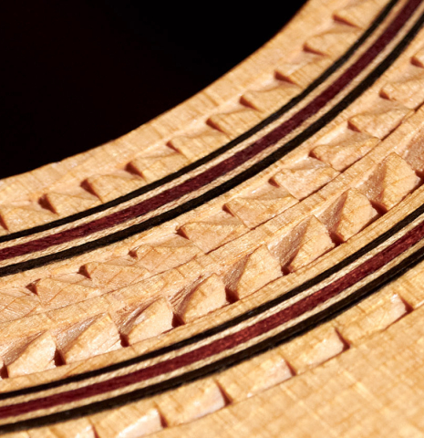 This is a close-up of the rosette of a 1986 Cynthia H. Burton SP/MH classical guitar