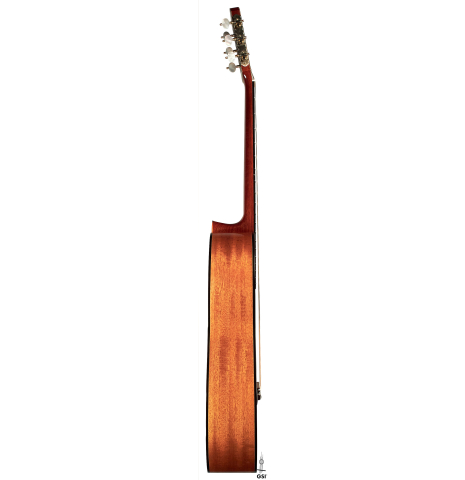 This is the side of a 1986 Cynthia H. Burton SP/MH classical guitar on a white background